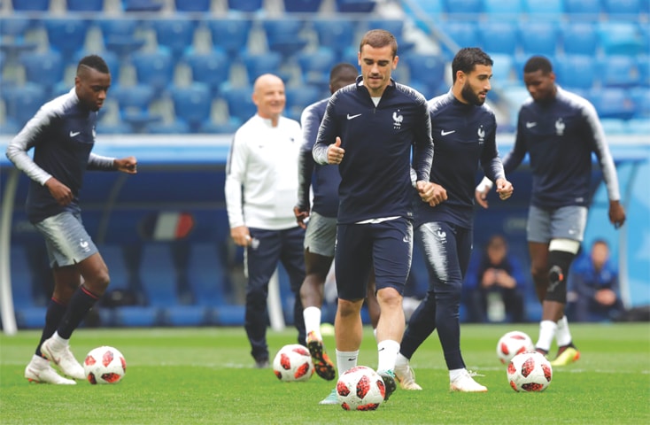 ST PETERSBURG: France’s Antoine Griezmann (front) and team-mates practise on Monday at the St Petersburg Stadium.—Reuters