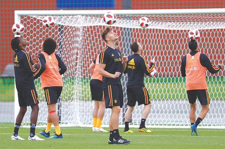 DEDOVSK: Belgium’s defender Thomas Meunier (C) and team-mates eye the ball as they prepare for the semi-final against France during a training session at the Guchkovo Stadium on Monday.—Reuters