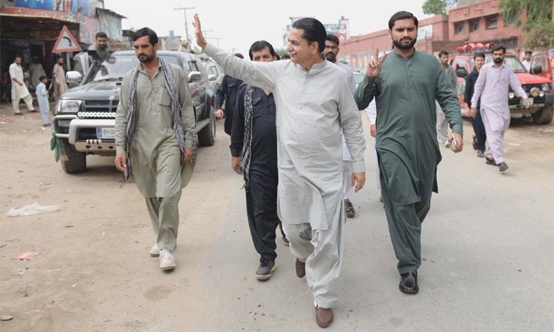 PML-N candidate Mian Javaid Latif visits his constituency. He alleges the loyalties of some PML-N local body members are being changed. He claims his party is not being given a level playing field. —Murtaza Ali/White Star