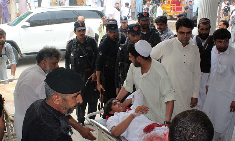 A youth injured in Mastung bomb blast is transported at a hospital in Bannu. — AFP