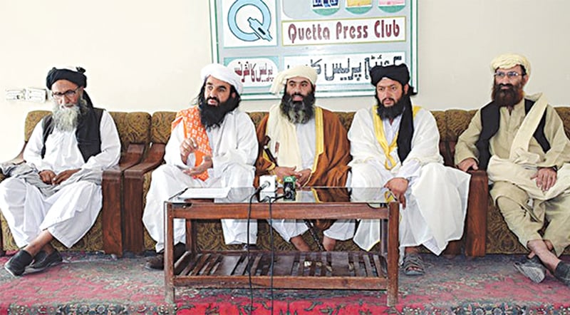 ASWJ provincial chief Ramzan Mengal (centre) addresses a press conference with JUI-Nazriyati leaders in June at the Quetta Press Club.