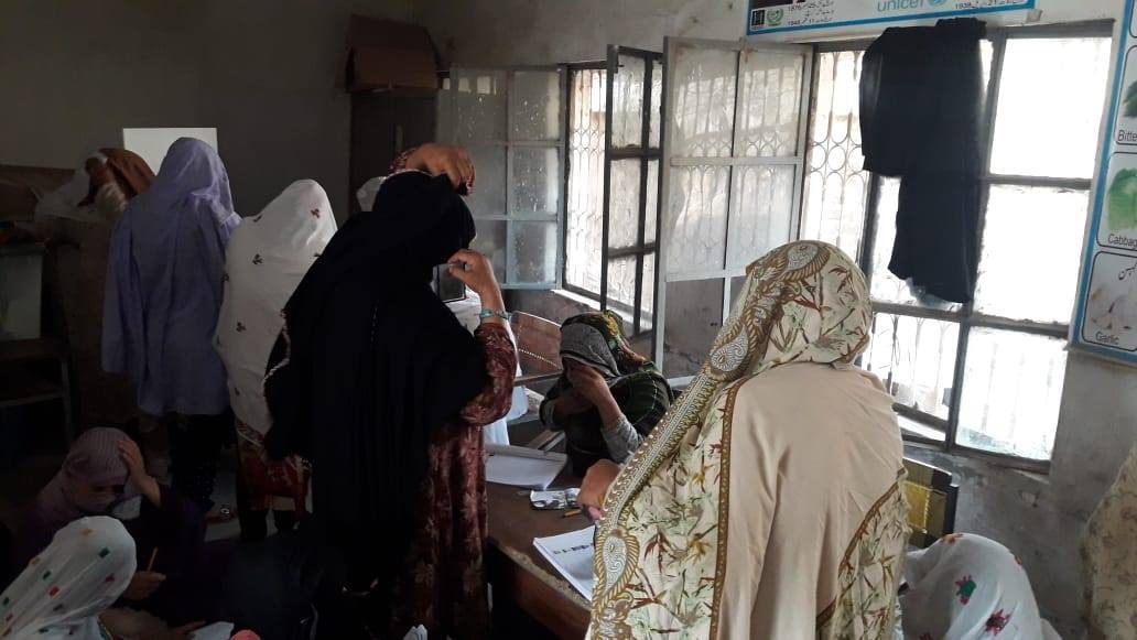 A photo of women voting at a Mansehra polling station.