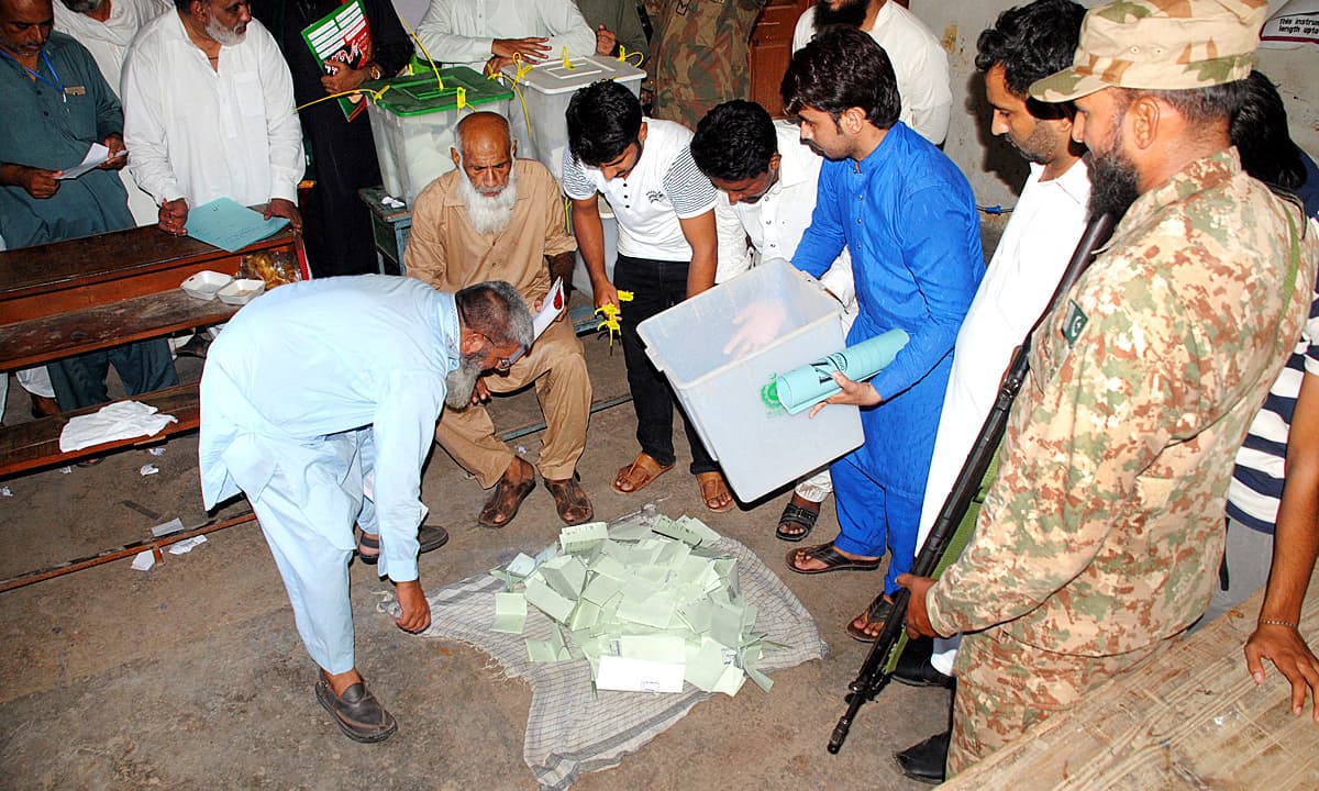 Polling officials start counting votes in Multan. ─ APP