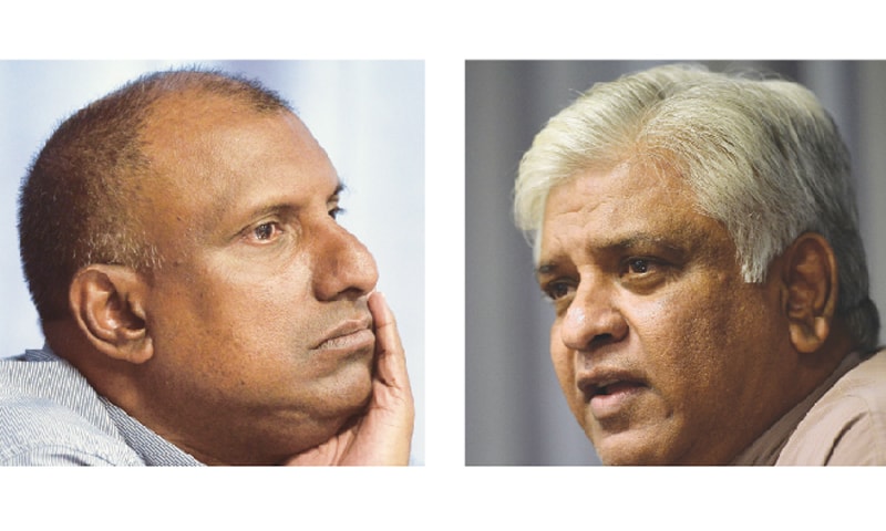 COLOMBO: Aravinda de Silva (L) and Arjuna Ranatunga attend a press conference on Tuesday.&mdash;AFP