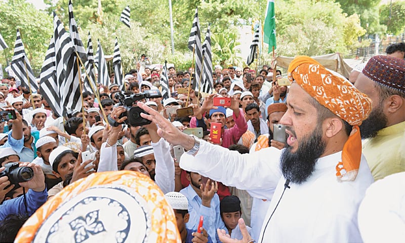 MAULANA Rashid Mehmood Soomro speaks at a rally in Larkana on Friday.—PPI MAULANA Rashid Mehmood Soomro speaks at a rally in Larkana on Friday.—PPI