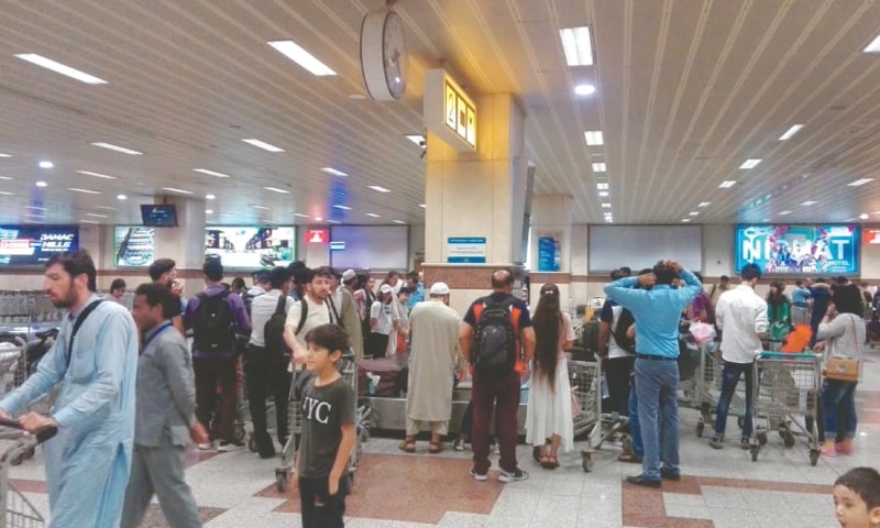 Lahore: Pakistanis stranded in China pictured at Allama Iqbal International Airport upon their return aboard Shaheen Air International flight NL-891 on Monday.—White Star Lahore: Pakistanis stranded in China pictured at Allama Iqbal International Airport upon their return aboard Shaheen Air International flight NL-891 on Monday.—White Star