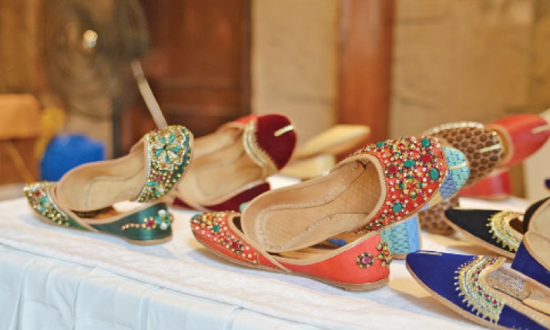 Visitors look at ornaments at a stall in the bazaar on Friday. The other pictures show footwear and honey on display. &mdash; Photos by the writer