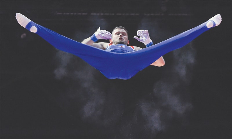 GLASGOW: Britain’s Dominick Cunningham competes on the horizontal bar in the men’s team final of the artistic gymnastics at the SSE Hydro.—AFP