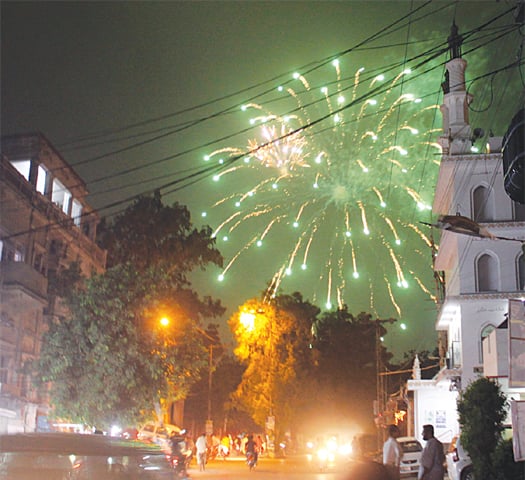 FIREWORKS illuminate a locality in Hyderabad on the eve of Independence Day.&mdash;Dawn
