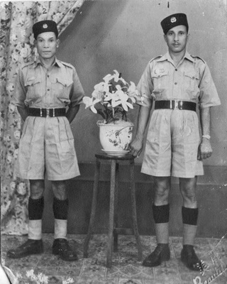 My maternal grandfather, Hayat Shah (right) posing for a photograph in his uniform. He came from a village near the town of Mansehra and served in the Naval Police Force.—Photo by author