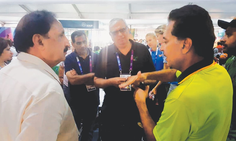 JAKARTA: POA president retired Lt Gen Syed Arif Hasan (C) listens to national hockey team manager Hasan Sardar (R) during his visit to the athletes villages at the 18th Asian Games on Friday.