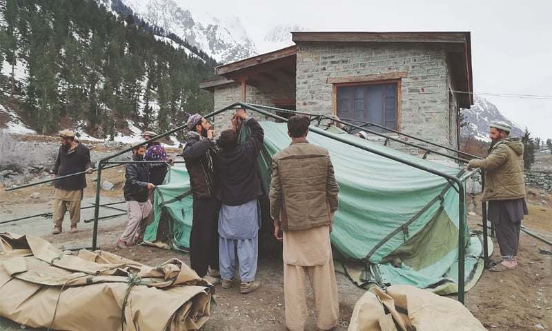 Setting up tents to make up for the lack of built classrooms