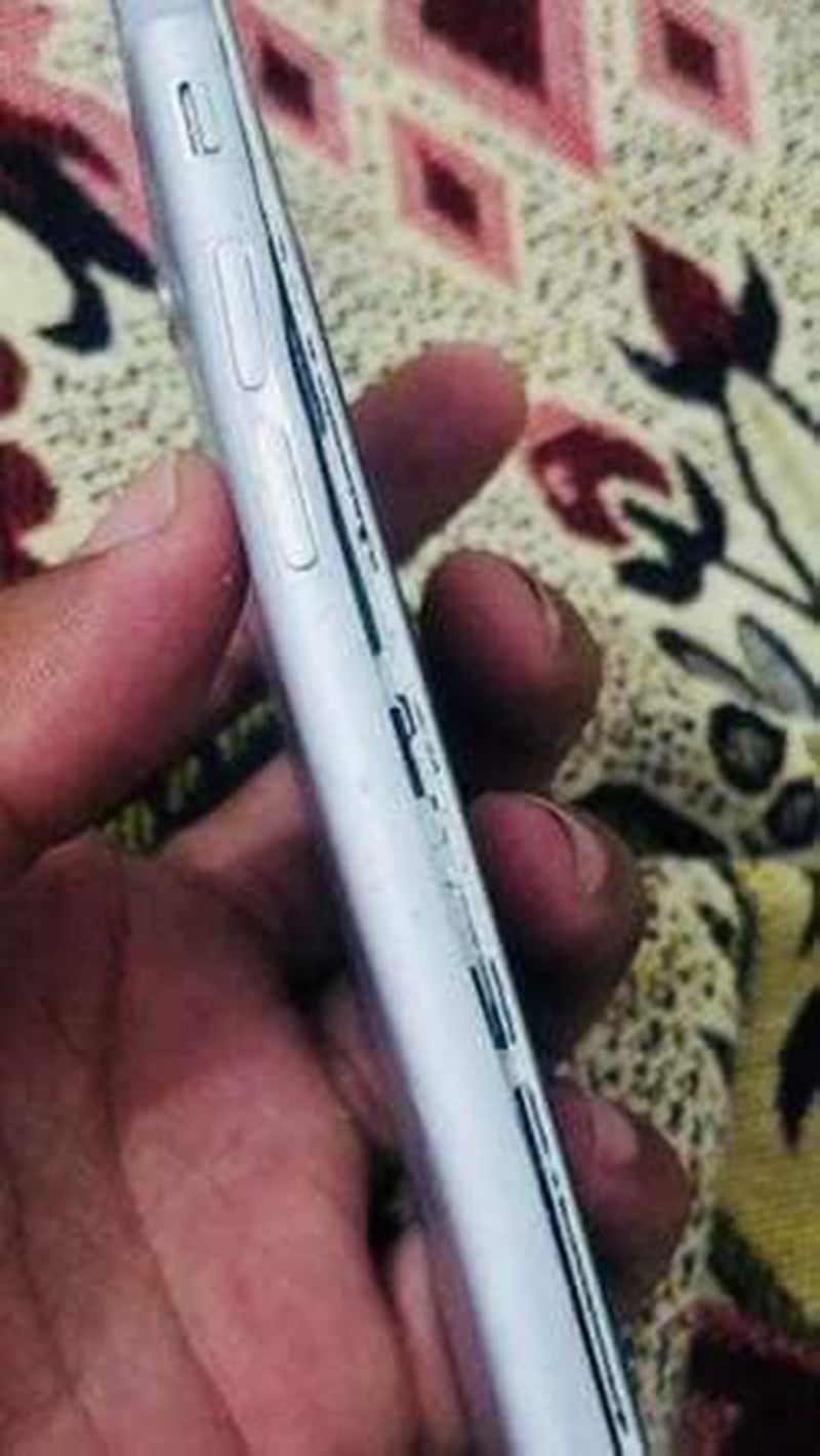 A photo of cameraman Aqib's damaged phone. — Photo by author