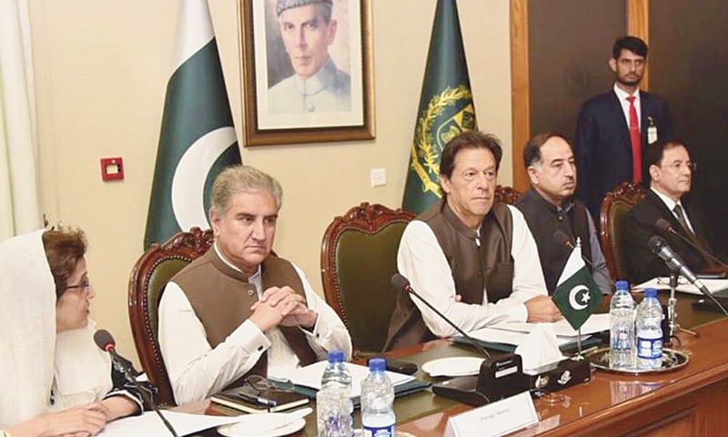 ISLAMABAD: Prime Minister Imran Khan attends a briefing during his maiden visit as the country’s chief executive to the Foreign Ministry on Friday. Foreign Minister Shah Mehmood Qureshi and Foreign Secretary Tehmina Janjua are also seen.—AP