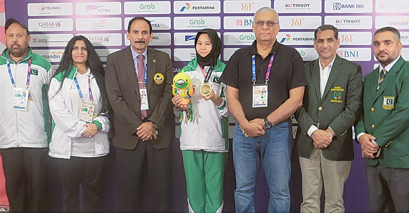 PAKISTAN’S bronze medal winner Nargis (C) is seen with POA president retired Lt Gen Arif Hasan, secretary Khalid Mahmood and chairman Pakistan Karate Federation Mohammad Jahangir on Saturday.