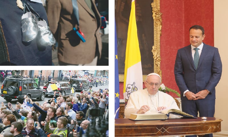 DUBLIN: Pope Francis signs the arrivals book (right) in Dublin Castle as Ireland’s Prime Minister Leo Varadkar looks on. People with baby shoes tied with black ribbons hanging from their neck (top left), symbolising the children who died in “mother and baby homes”, the homes where children were exiled for the shame of having been born to unwed mothers, protest ahead of the visit of Pope Francis. People line the street as Pope Francis leaves St Mary’s Pro-Cathedral in Dublin on Saturday, during his visit to Ireland to attend the 2018 World Meeting of Families.—Agencies