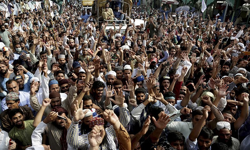 TLP supporters shout slogans during a march towards Islamabad on Wednesday in Lahore. — AP