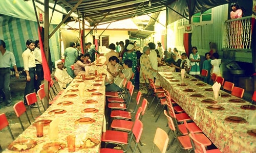 A scene from a wedding celebration in the kampong (rural housing) in the late 1980s.