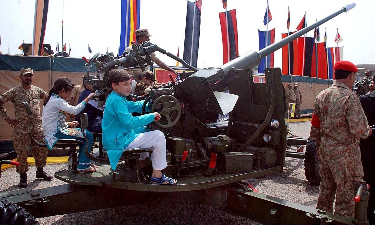 Visitors viewing the displayed arms and ammunition at Karnal Sher Khan Stadium in Peshawar. — APP