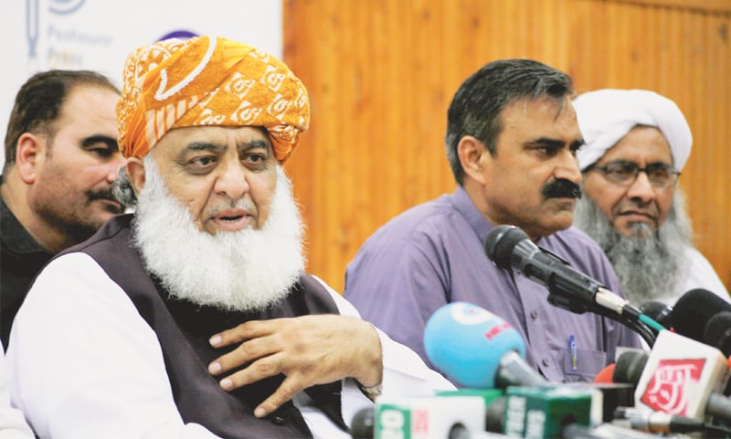 Maulana Fazlur Rehman speaking at the press conference on Thursday.—Dawn Maulana Fazlur Rehman speaking at the press conference on Thursday.—Dawn