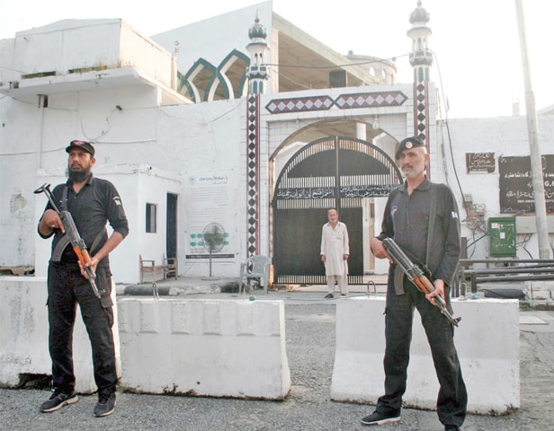 Security personnel stand outside the G-6 Imambargah on Tuesday. — Online