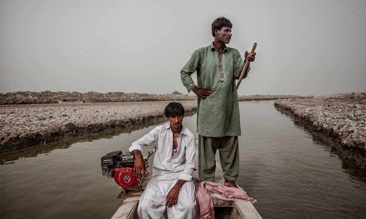 Two Mohanas on their motorboat | Photos by Mohammad Ali, White Star