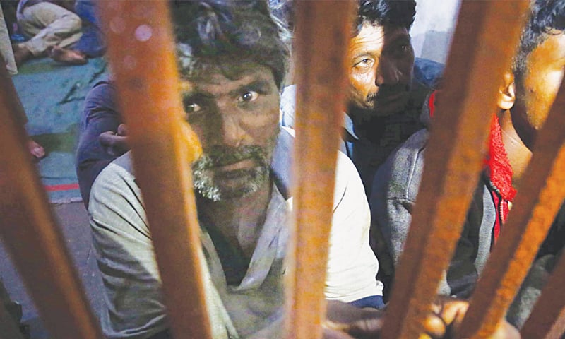 INDIAN fishermen in the lock-up of the Docks police station.—PPI INDIAN fishermen in the lock-up of the Docks police station.—PPI
