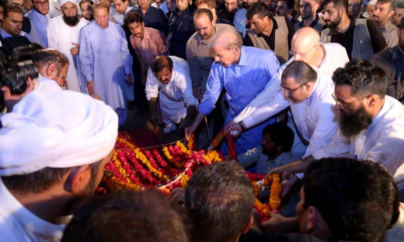 Flowers being placed on Begum Kulsoom's grave. —Photo courtesy PML-N