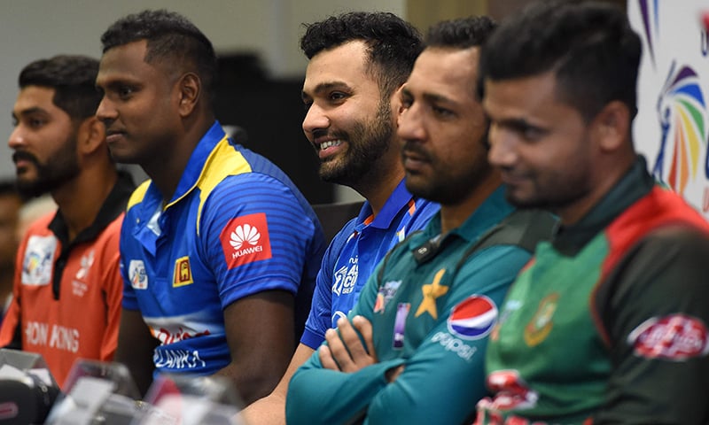 Indian cricket team captain Rohit Sharma (C) speaks during an Asia Cup press conference as Hong Kong cricket team captain Anshuman Rath (L), Sri Lankan cricket team captain Angelo Mathews (2L), Pakistan cricket captain Sarfraz Ahmed (2R) and Bangladesh cricket captain Mashrafe Mortaza (R) look on at the Dubai International Cricket Stadium in Dubai. —AFP