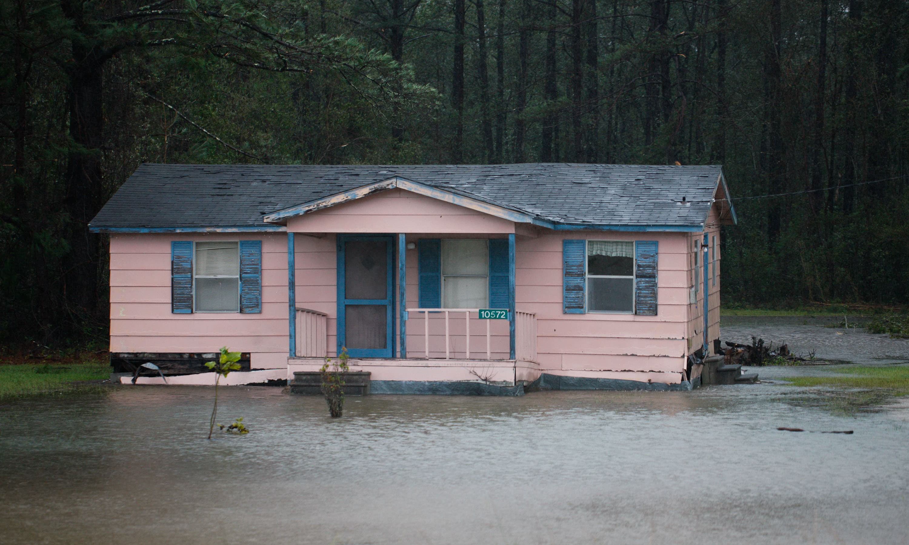 A home sits in flood water outside Maysville, NC. — AFP