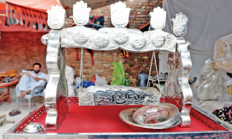 A cradle at a shop near the shrine of Hazrat Shah Chan Chiragh. &mdash; Photos by Mohammad Asim