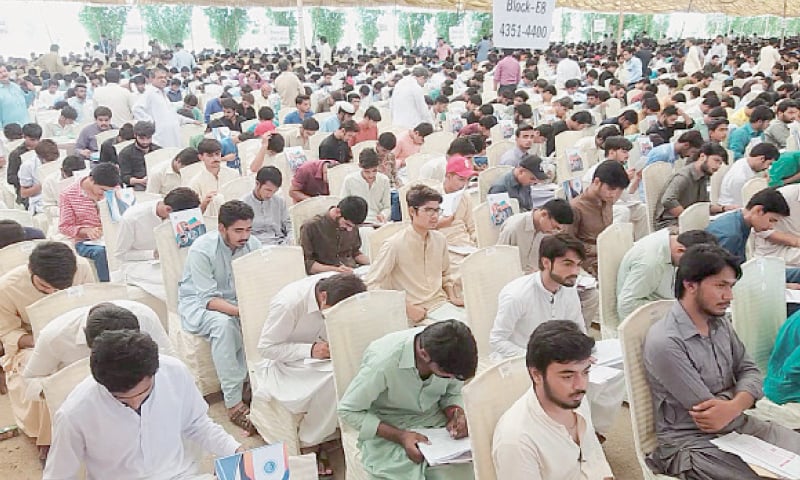 CANDIDATES take the test on Sunday for admission to the Quaid-i-Awam university.—Dawn CANDIDATES take the test on Sunday for admission to the Quaid-i-Awam university.—Dawn