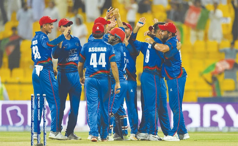 ABU DHABI: Afghan players celebrate after winning the match.— AFP