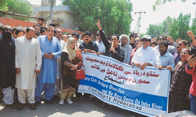 CIVIL society activists hold a demonstration outside Hyderabad Press Club on Tuesday.&mdash;Dawn