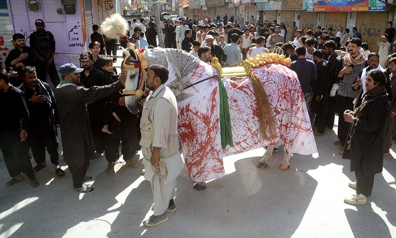 Mourning procession with Zuljana passing through a road in Quetta. —APP