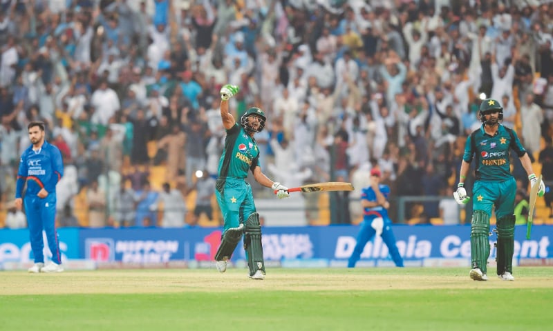 ABU DHABI: Hasan Ali (C) celebrates after Pakistan’s saviour Shoaib Malik (R) struck the winning boundary at the end of the Asia Cup’s Super Four match while Afghanistan paceman Aftab Alam looks crestfallen at the Sheikh Zayed Stadium on Friday night.—AFP