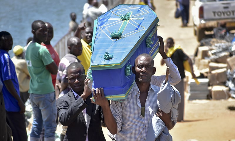 Men carry a coffin for one of the victims of the MV Nyerere passenger ferry on Ukara Island, Tanzania. &mdash;AP