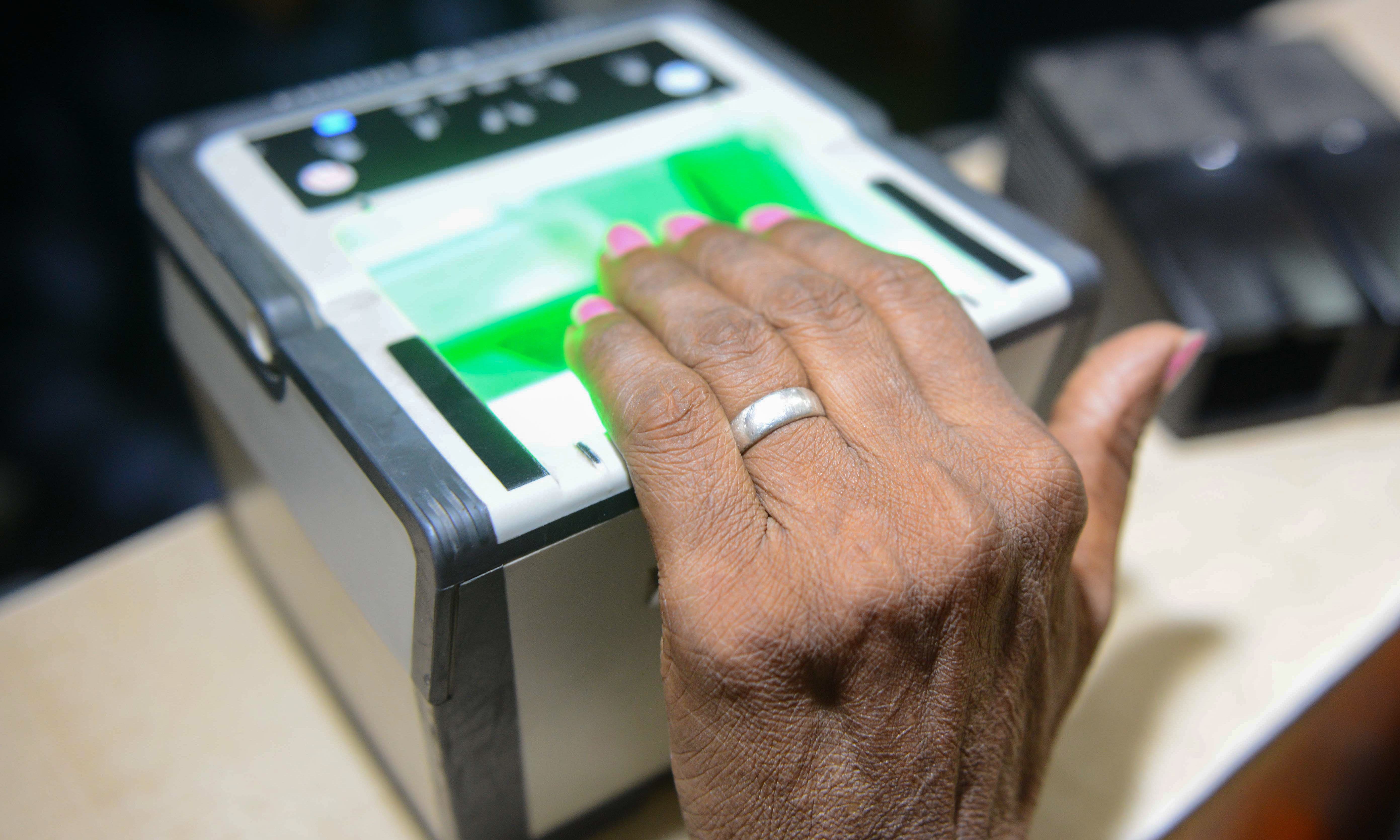 This photo taken on July 17, 2018 shows an Indian woman getting her fingerprints read during the registration process for Aadhaar cards in Amritsar. — AFP This photo taken on July 17, 2018 shows an Indian woman getting her fingerprints read during the registration process for Aadhaar cards in Amritsar. — AFP