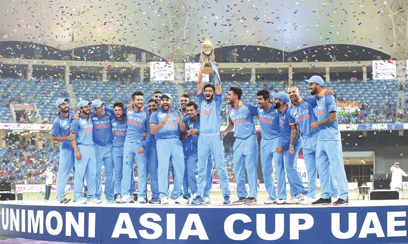 Indian cricketers celebrate with the trophy after winning the Asia Cup final against Bangladesh in Dubai on Friday.—AP Indian cricketers celebrate with the trophy after winning the Asia Cup final against Bangladesh in Dubai on Friday.—AP