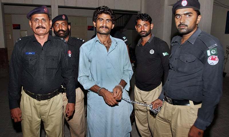 In this file photo, police present Muhammad Wasim before the media in Multan. &mdash; AP/File