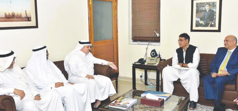 ISLAMABAD: Adviser to Saudi Arabia’s ministry of energy, industry and mineral resources Ahmad Hameed Al-Ghamdi talks to Finance Minister Asad Umar during a meeting on Monday.—APP