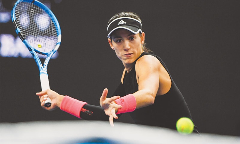Spain&rsquo;s Garbine Muguruza eyes a return during her second round match against Aryna Sabalenka of Belarus at the China Open on Tuesday. &mdash; AFP
