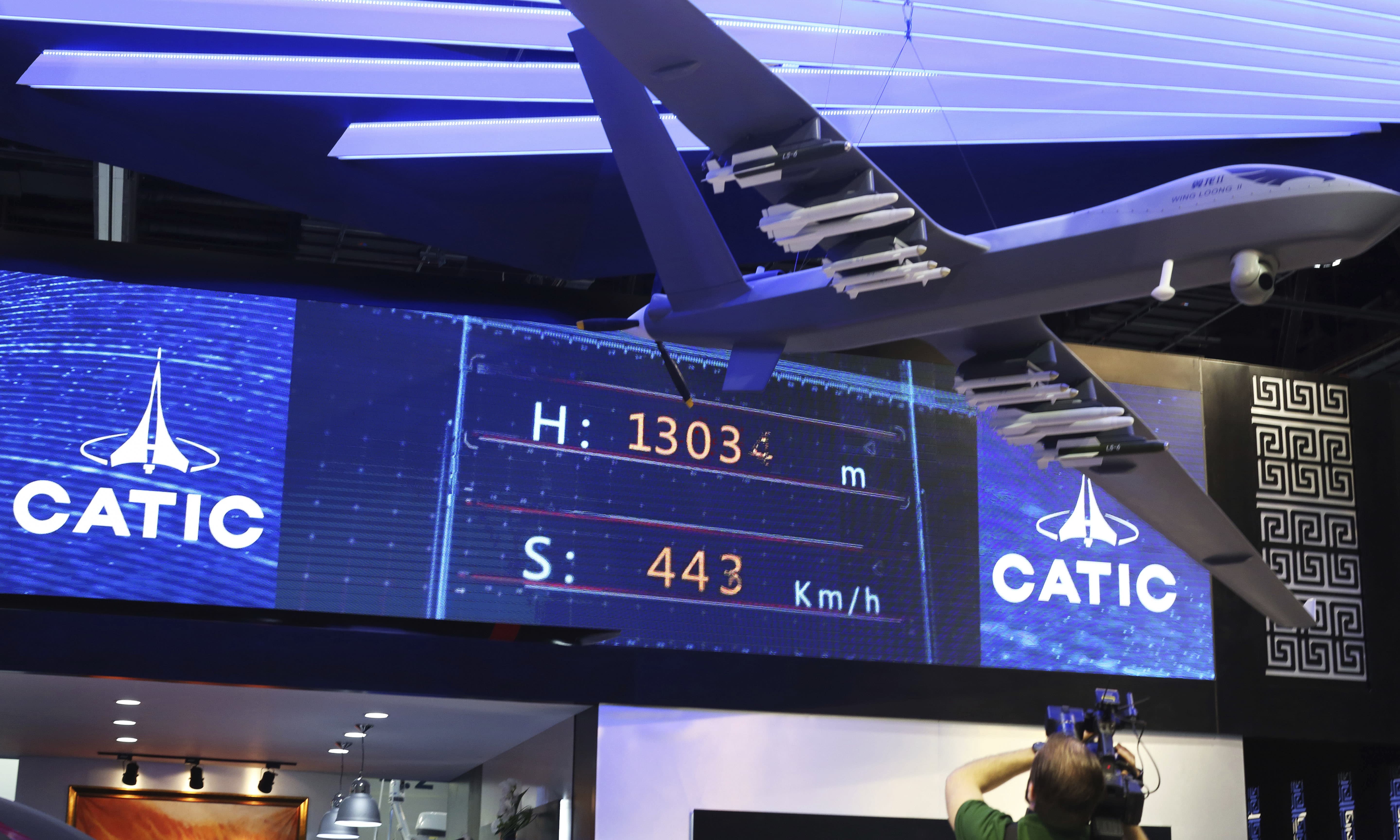 A model of the Wing Loong II weaponized drone hangs above the stand for the China National Aero-Technology Import and Export Corp at a military drone conference in Abu Dhabi in February 2018. — AP A model of the Wing Loong II weaponized drone hangs above the stand for the China National Aero-Technology Import and Export Corp at a military drone conference in Abu Dhabi in February 2018. — AP