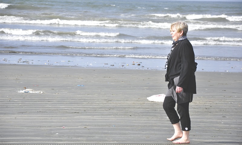 Strolling on the beach during her visit to Karachi in 2011