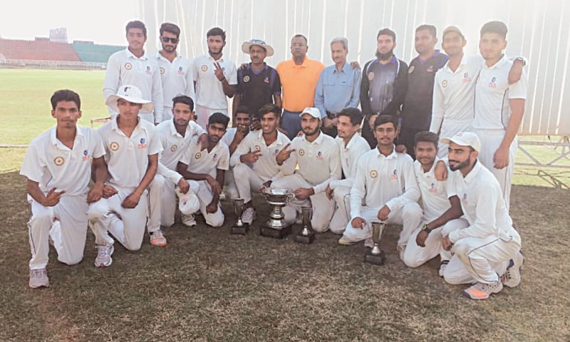 MIRPUR: The jubilant Faisalabad team members pose with the trophy after defeating Karachi Blues in the PCB Under-19 Inter-region (three-day) tournament final at the Mirpur Cricket Stadium on Sunday.—Courtesy PCB MIRPUR: The jubilant Faisalabad team members pose with the trophy after defeating Karachi Blues in the PCB Under-19 Inter-region (three-day) tournament final at the Mirpur Cricket Stadium on Sunday.—Courtesy PCB