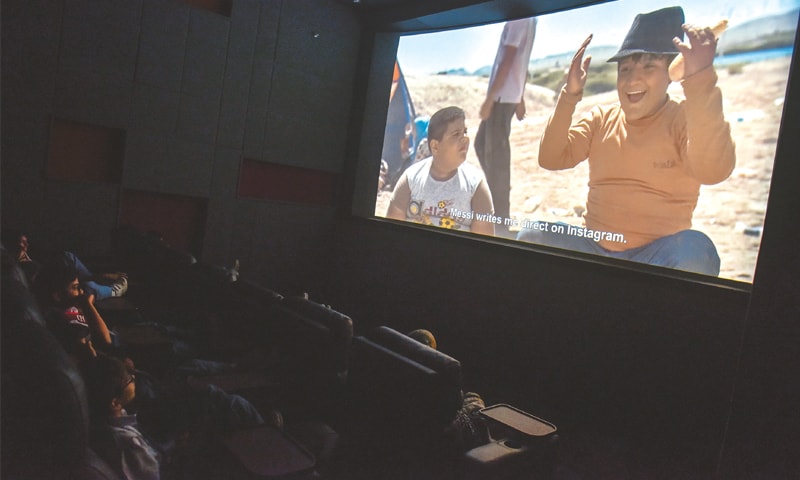 YOUNGSTERS enjoy a movie during the festival on Wednesday.—White Star