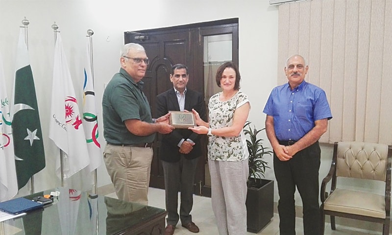 LAHORE: Susan Margeret Dawson, Pakistan women rugby team&rsquo;s New Zealand-born coach and former All-Blacks player, receives a shield from POA president retired Lt Gen Arif Hasan at the Olympic House on Wednesday.