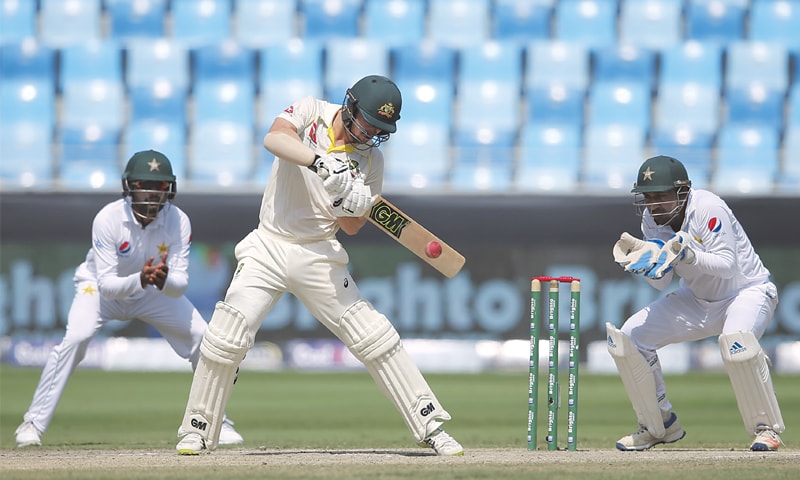 DUBAI: Australian batsman Travis Head plays a shot during the first Test against Pakistan on Thursday.—AP