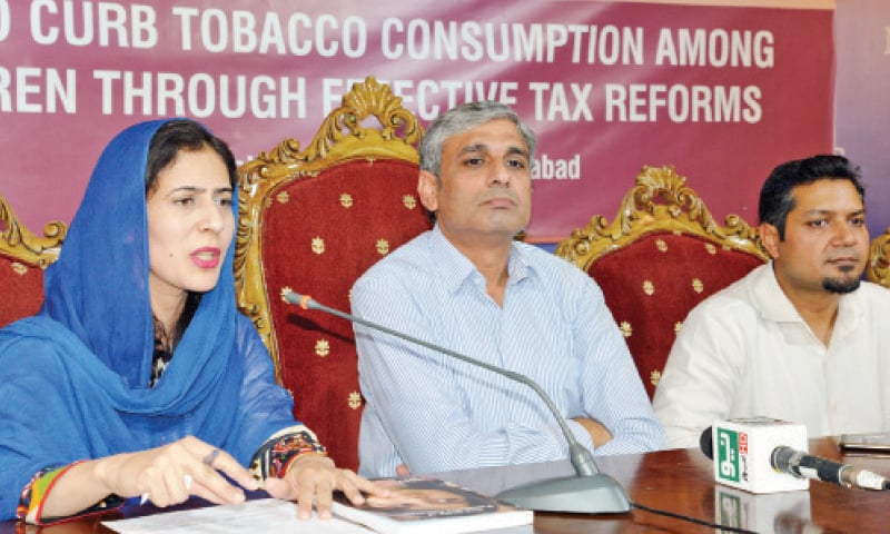 Sparc Manager Programme Development Asiya Arif speaks at the press conference on Tuesday. The organisation’s executive director, Sajjad Cheema, is also present. — Photo by Ishaque Chaudhry