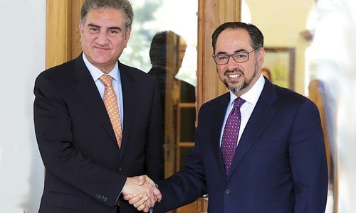 Foreign Minister Shah Mehmood Qureshi shakes hands with Afghan Foreign Minister Salahuddin Rabbani. — Photo/File